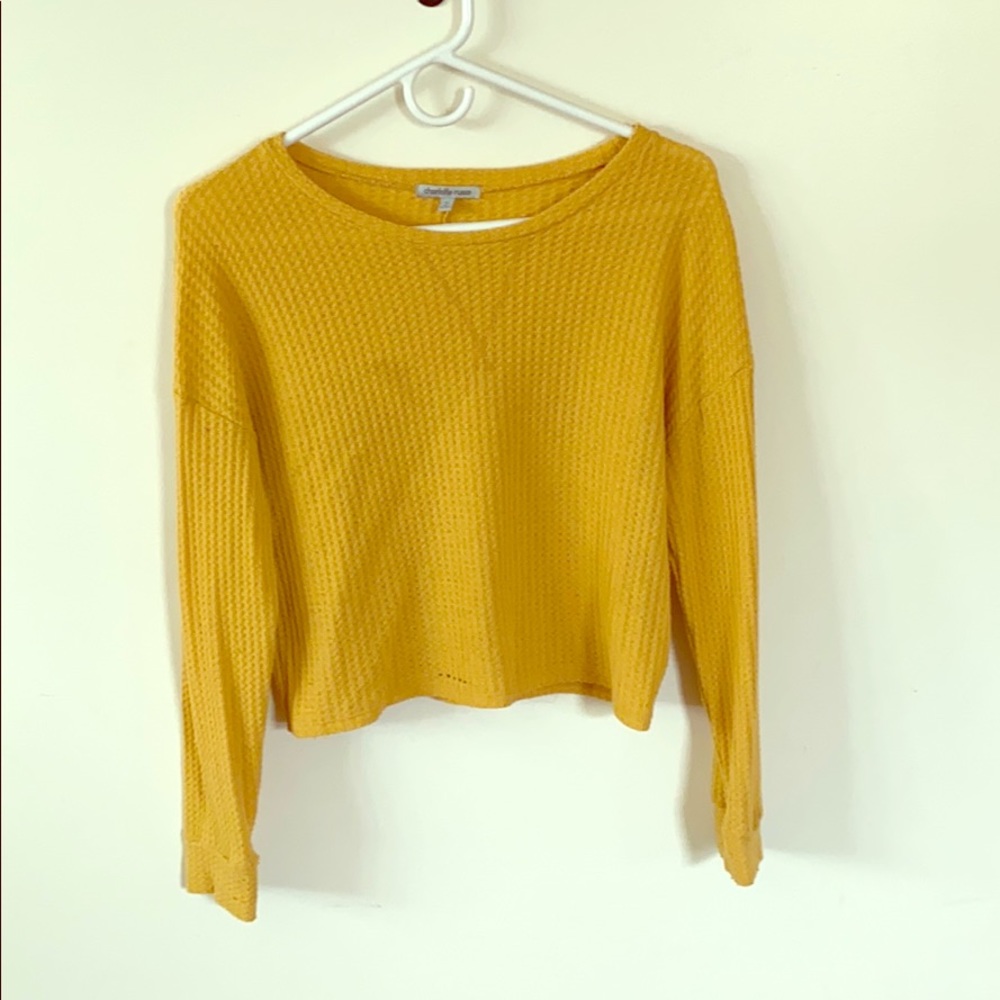 A yellow cropped shirt